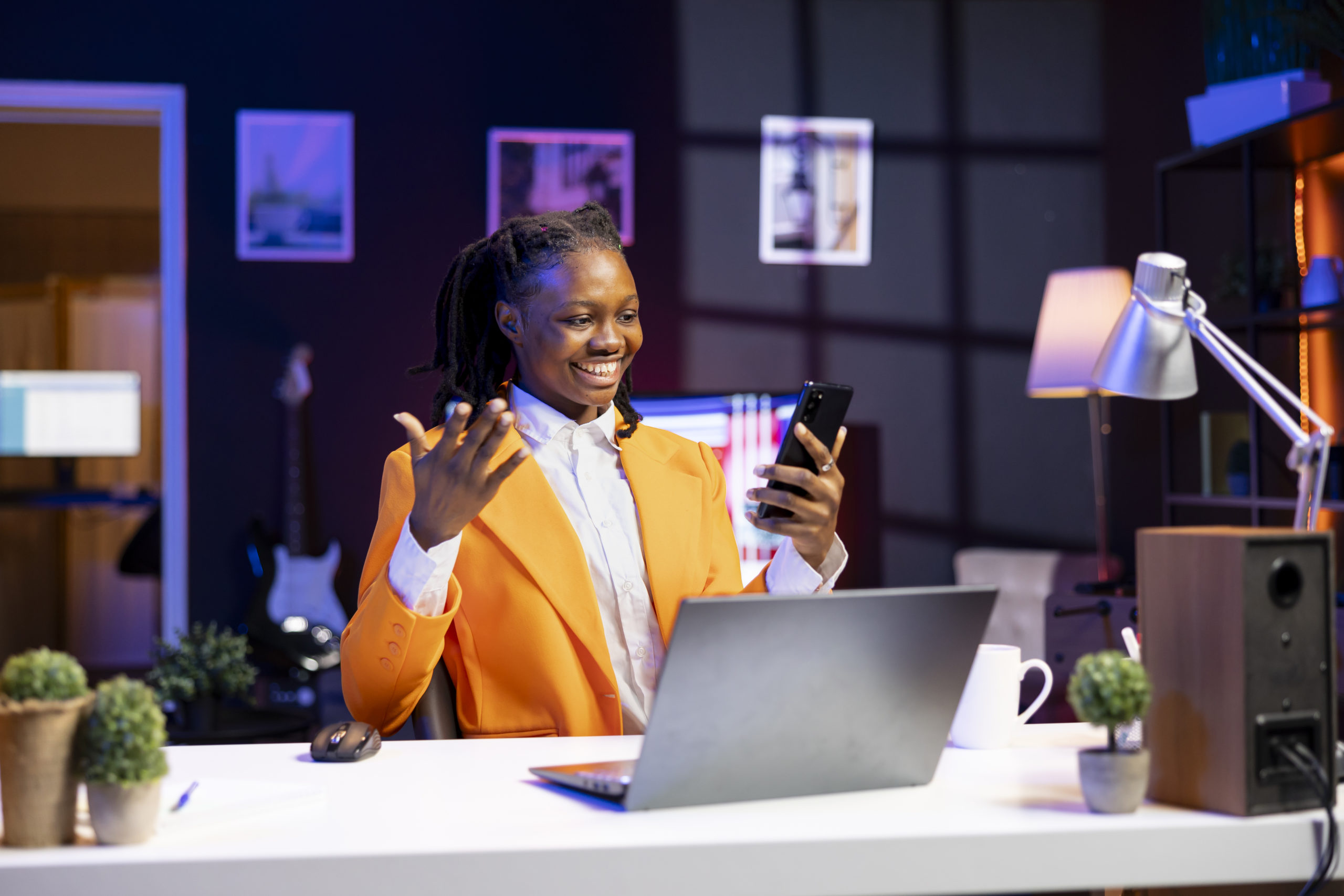 happy-woman-relaxing-apartment-texting-friends-cellphone